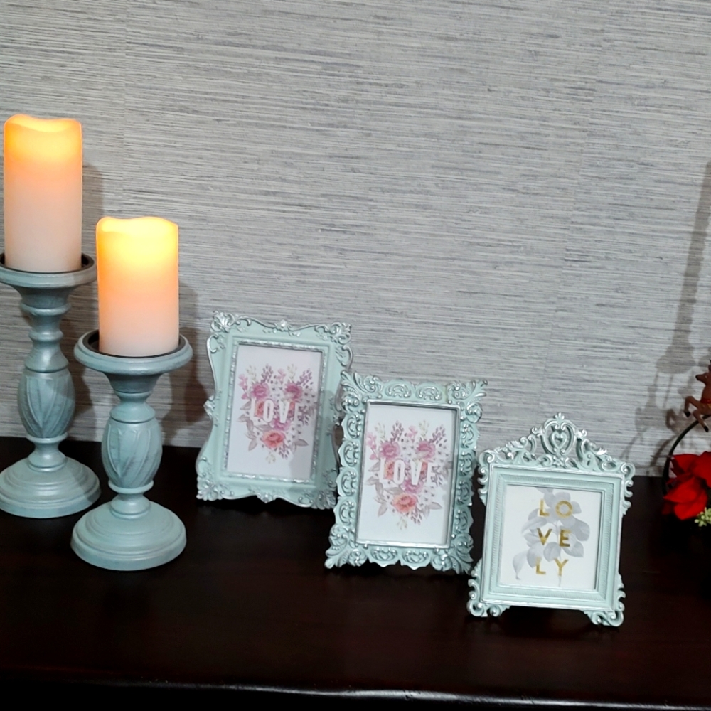 Beautiful picture frames and candlestick holders.